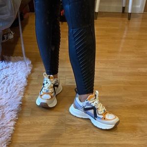 Zara Chunky cream, black orange and lilac trainers.